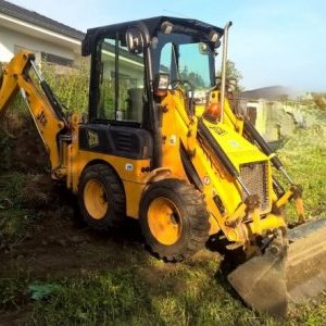 foto JCB 1CX doky 4lyzki widly 3t mini koparko-ladowarka